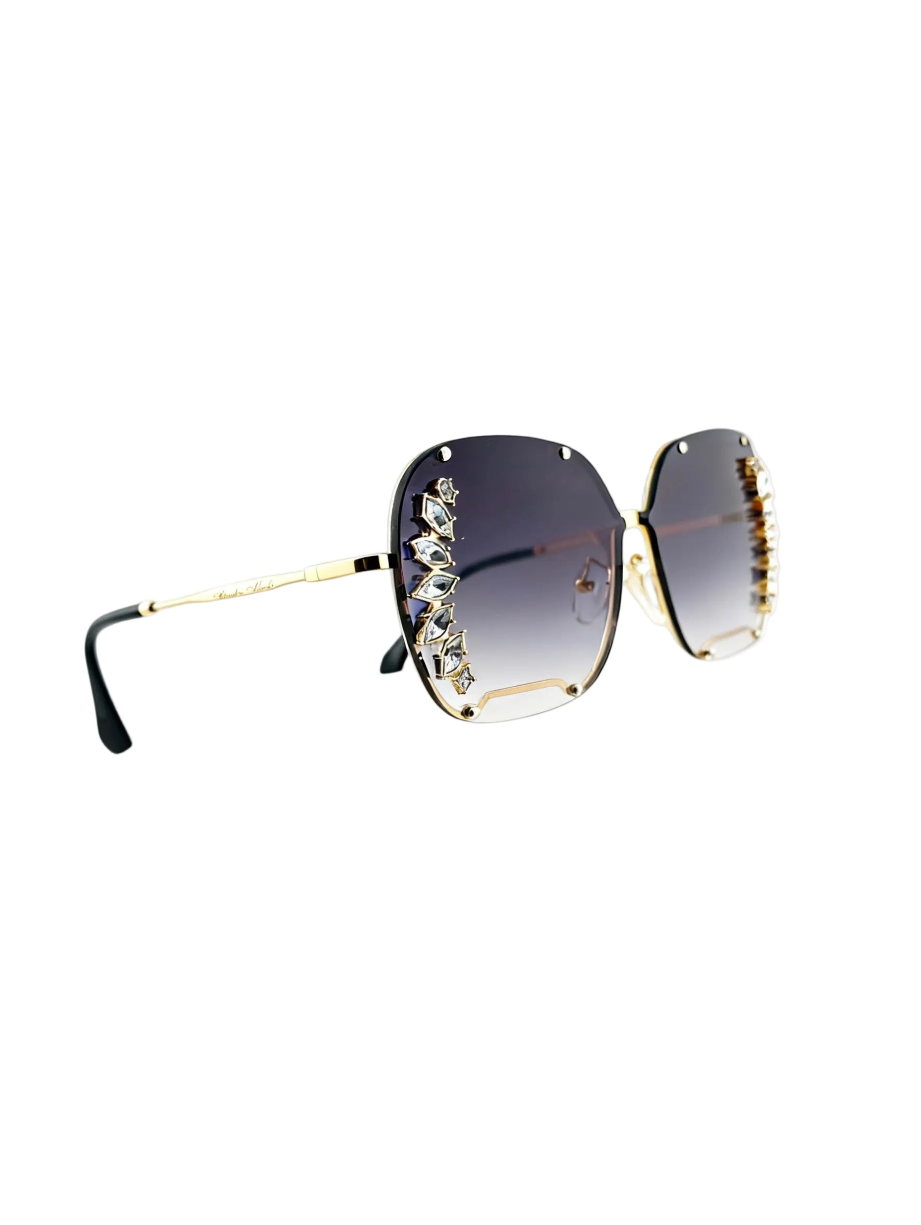 Oversized square sunglasses with dark gradient lenses, gold metal frames, and crystal embellishments on the outer edges, shown on a white background.